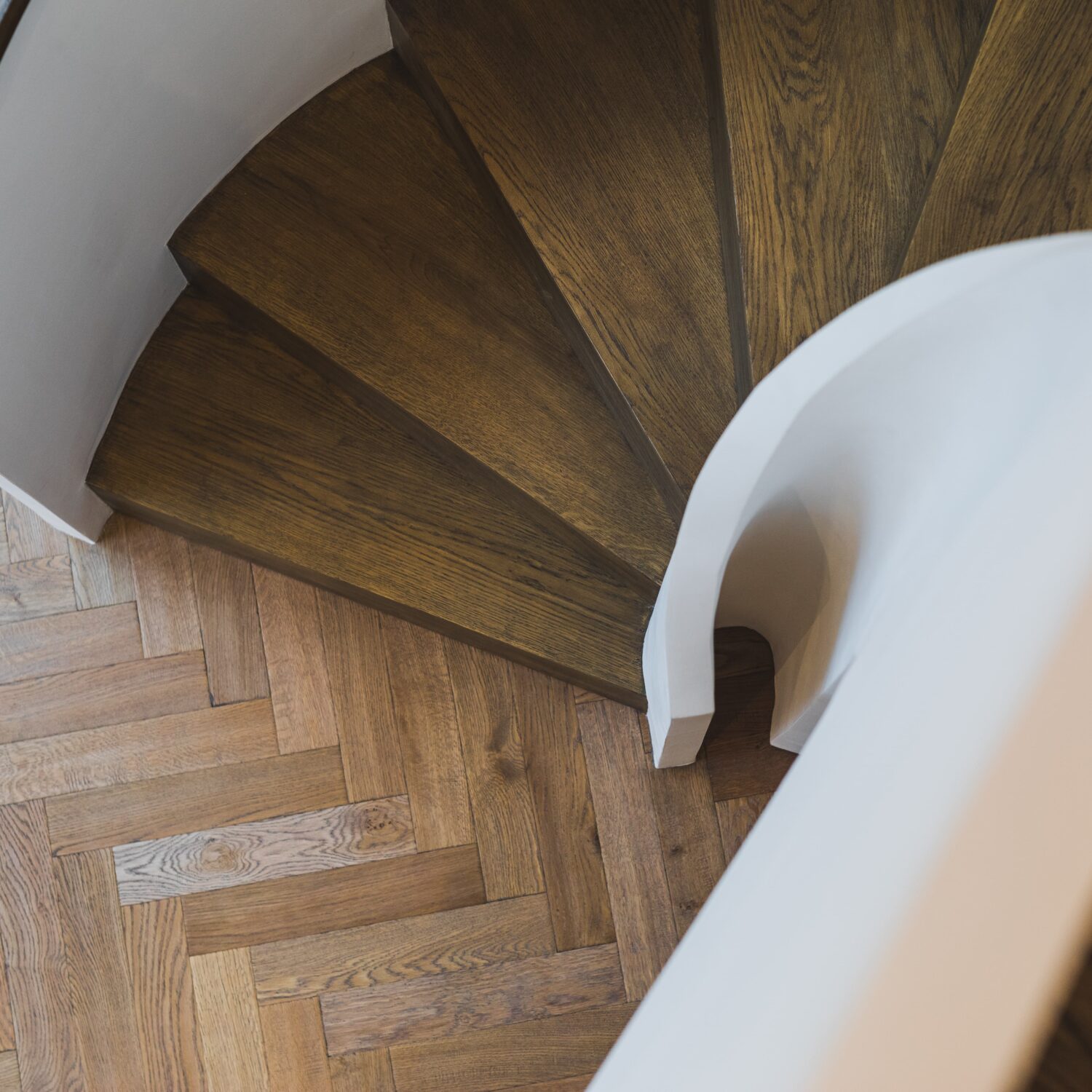 Close up of spiral staircase looking downwards to the ground floor