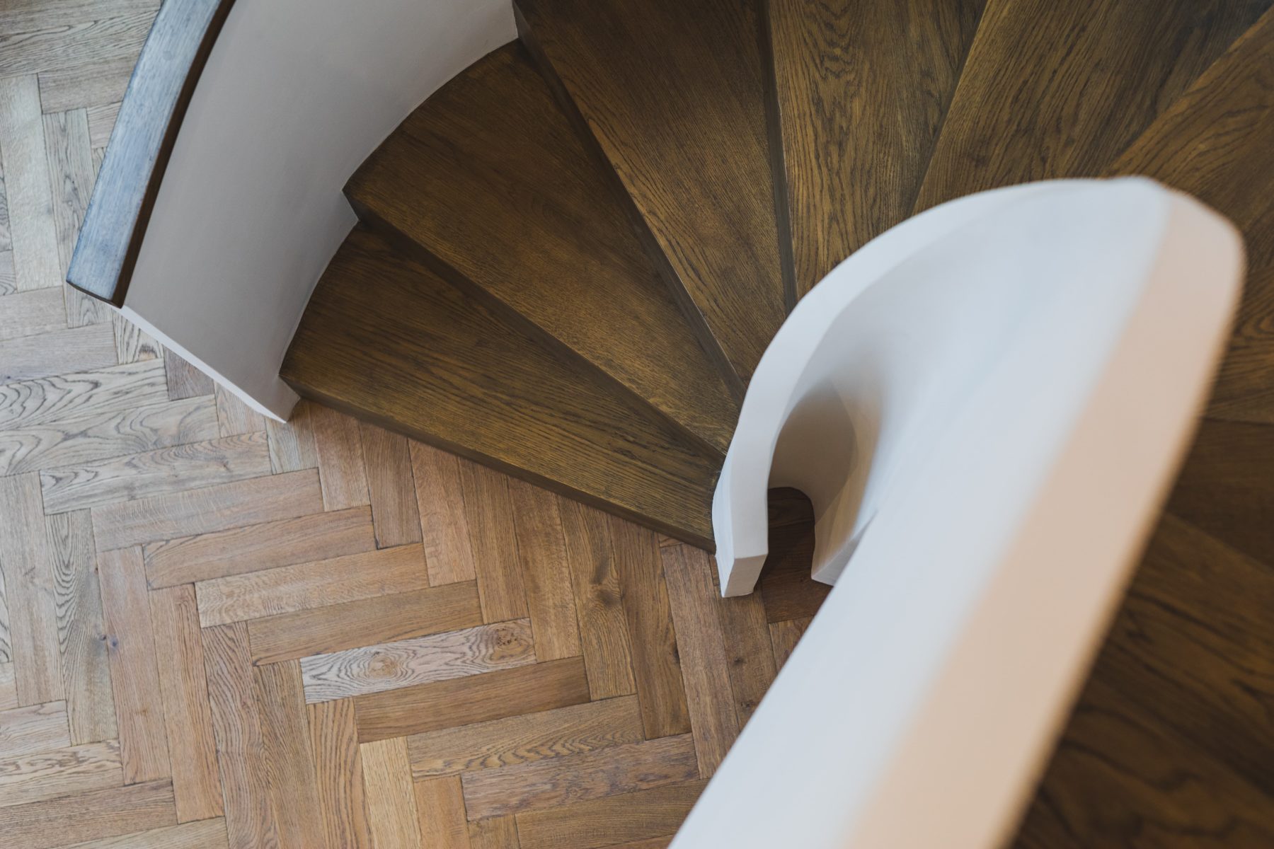 Close up of spiral staircase looking downwards to the ground floor