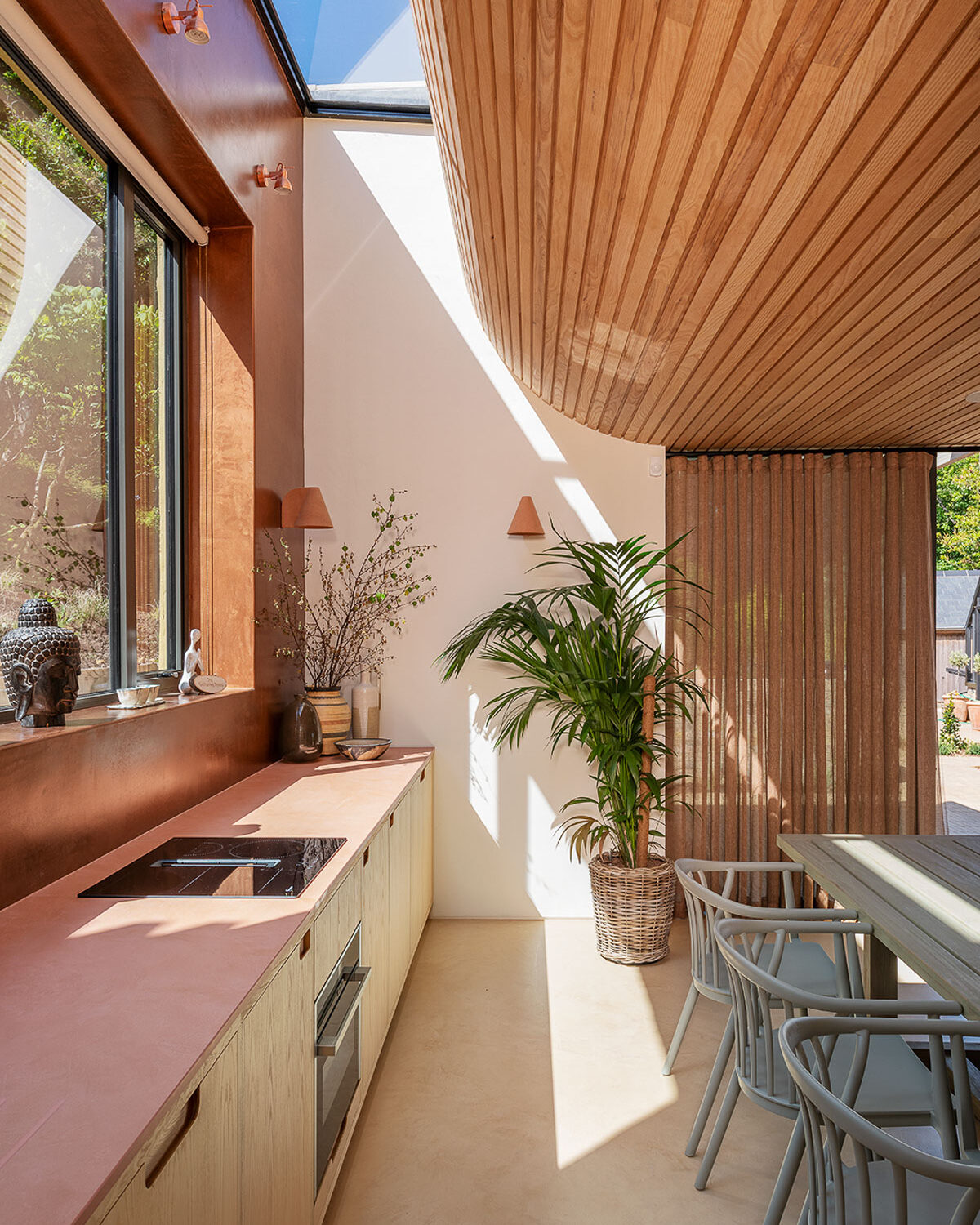 Slot rooflight above timber slatted curved ceiling, VESP architects, Dorset