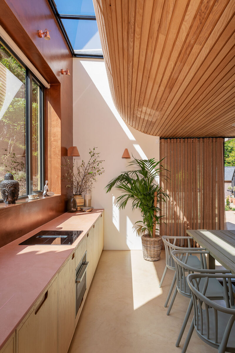 Slot rooflight above timber slatted curved ceiling, VESP architects, Dorset