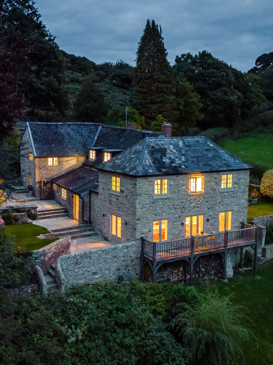 New stone extension with traditional windows and balcony to listed house by VESP architects