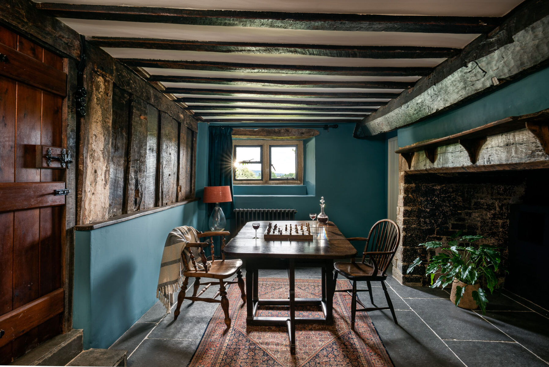 Historic timber plank screen in hallway and dining room by VESP architects