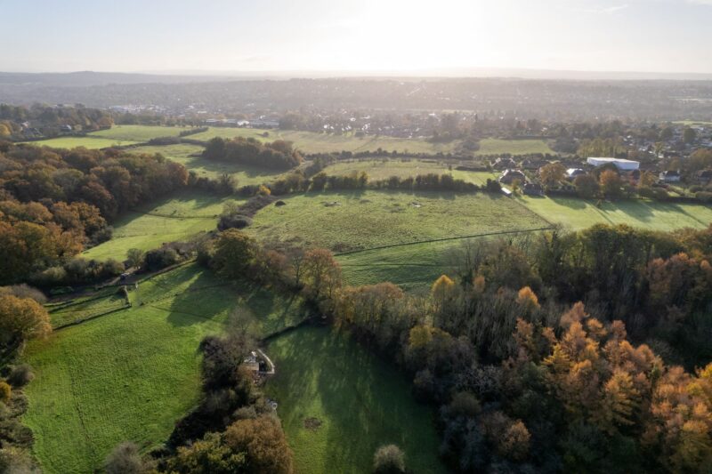 View of isolated plot that qualified for NPPF HO11 (e) consideration. Meadow plot with boundary hedgerows and pockets of woodland.